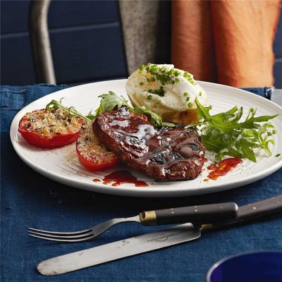 BBQ Steak with Jacket Potatoes & Garlic-Crumbed Tomatoes