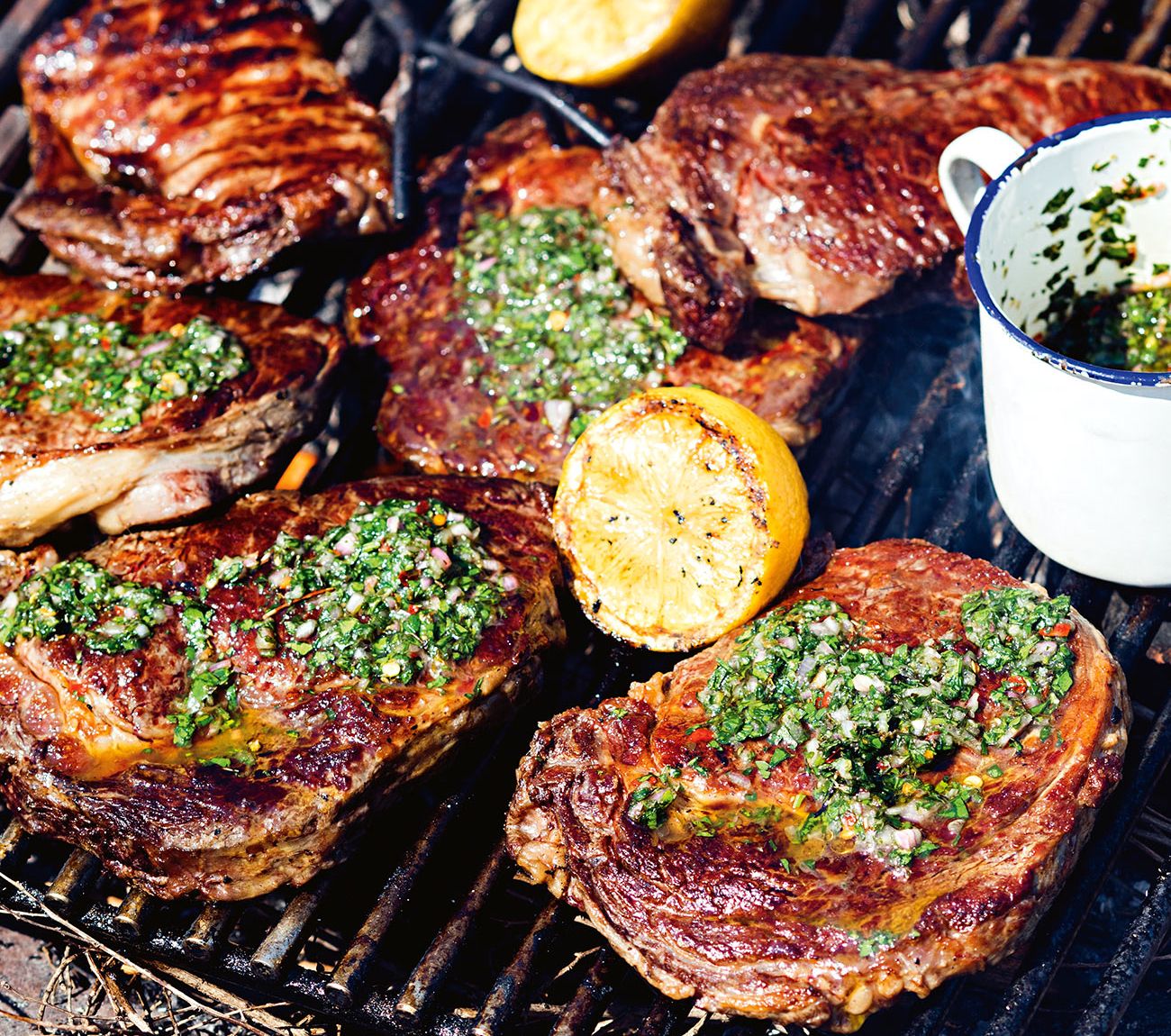 https://foodhub.scene7.com/is/image/woolworthsltdprod/1801-grilled-steaks-with-chimichurri:Mobile-1300x1150