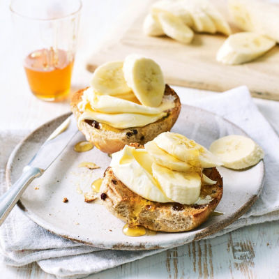 Hot Cross Bun Topped With Cream Cheese And Fruit
