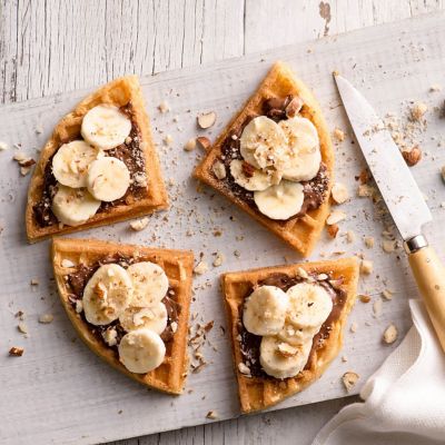 Waffles With Nutella, Banana And Crushed Hazelnuts