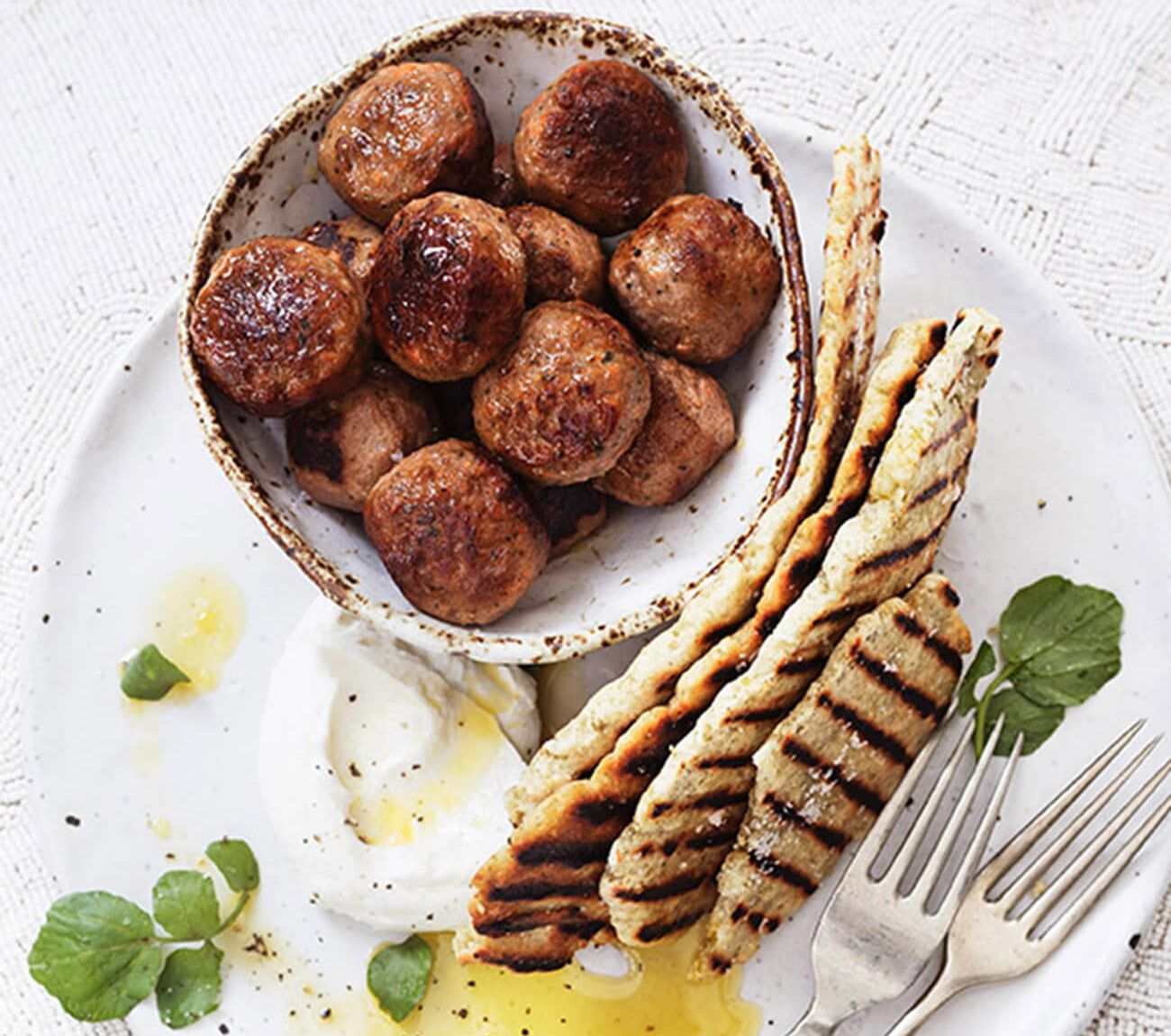 https://foodhub.scene7.com/is/image/woolworthsltdprod/1810-meatballs-with-labne-and-pumpkin-seed-flatbread:Mobile-1300x1150