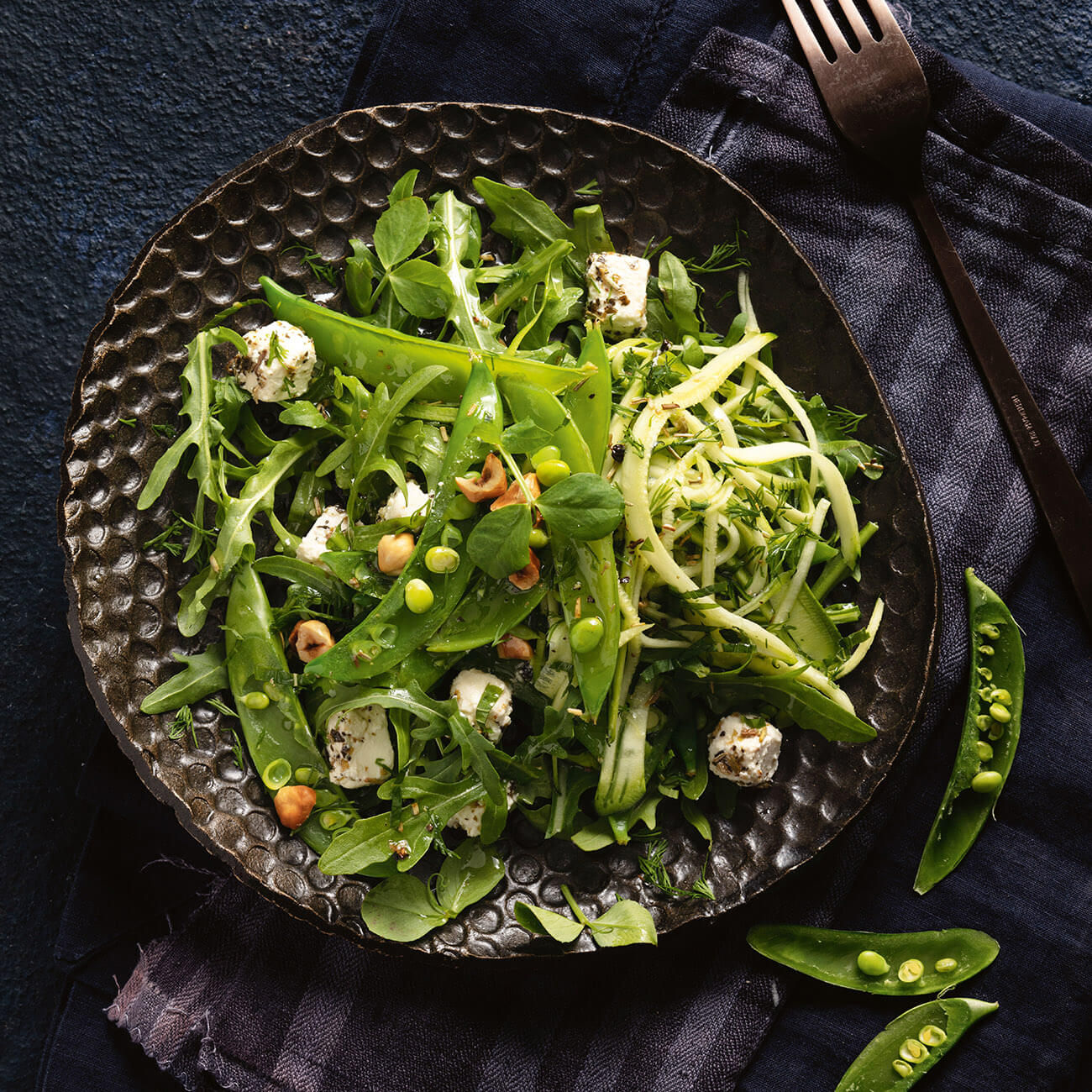 https://foodhub.scene7.com/is/image/woolworthsltdprod/1811-sugar-snap-peas-mint-and-hazelnut-salad:Square-1300x1300