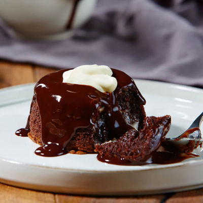 Decadent Chocolate Puddings With A Rich Chocolate Sauce