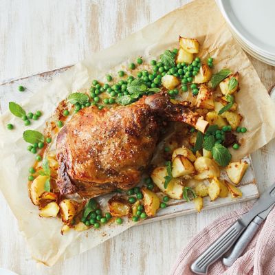 Roast Lamb With Smashed Potatoes Peas And Yoghurt Sauce