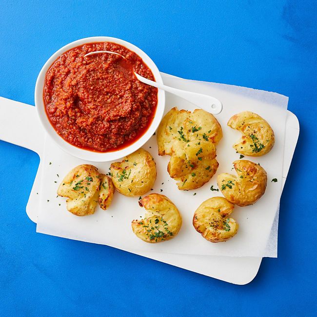 Smashed potatoes with veggie tomato sauce