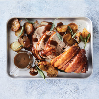 Roast pork shoulder With roasted apples and maple gravy