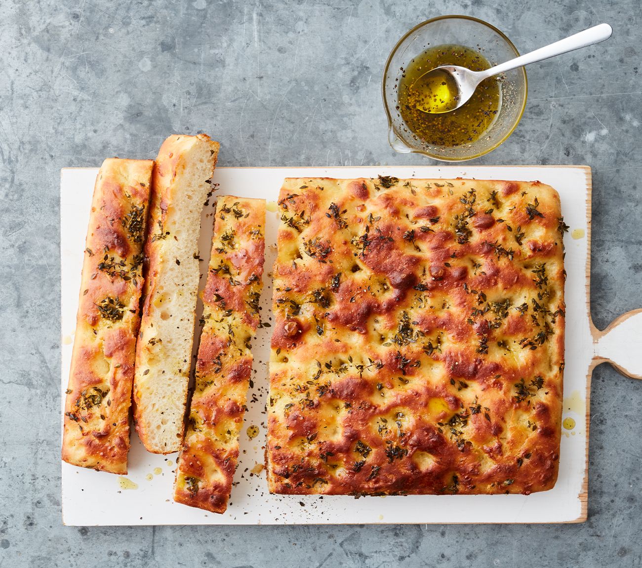 https://foodhub.scene7.com/is/image/woolworthsltdprod/2106-thyme-and-parmesan-focaccia:Mobile-1300x1150