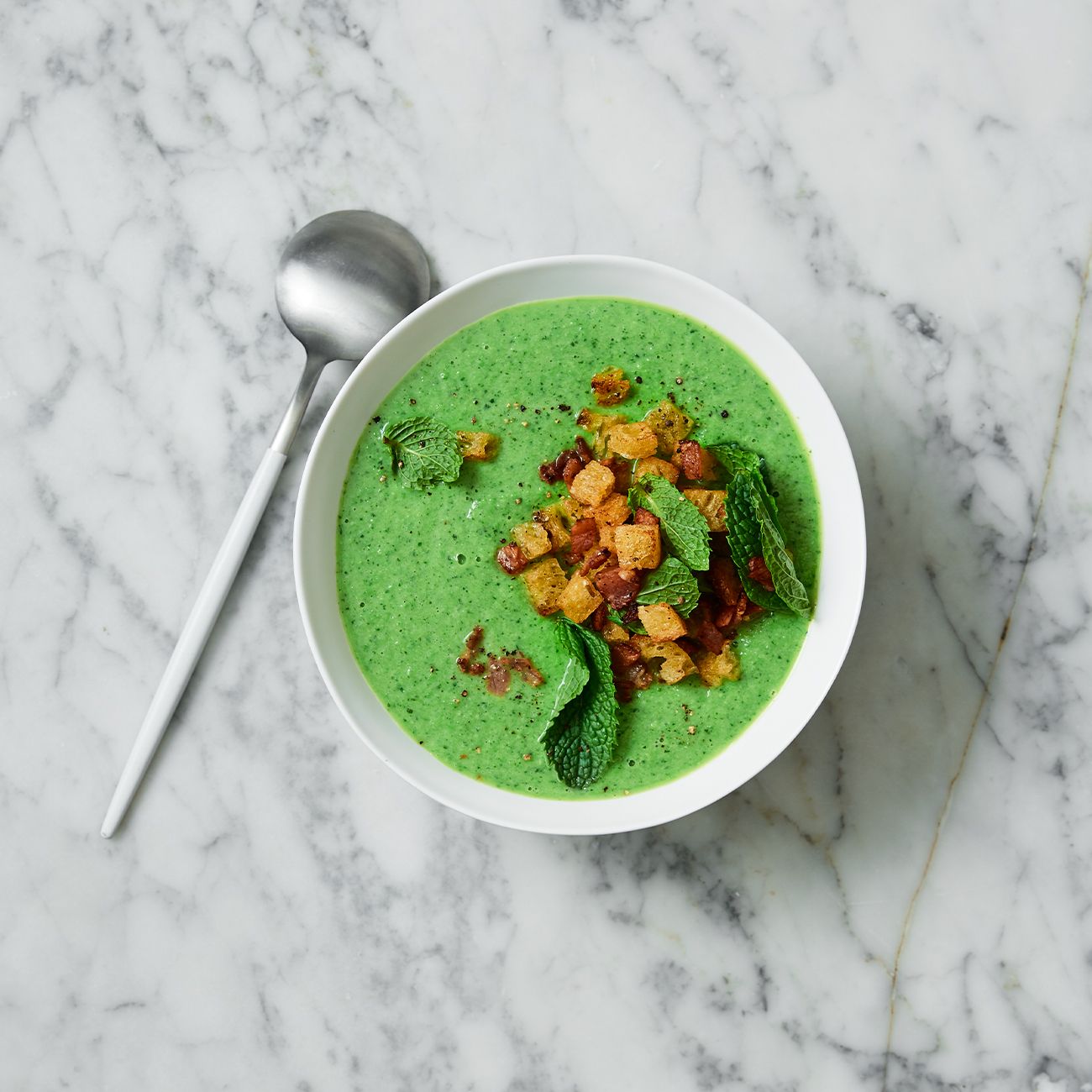 Minted pea soup with bacon croutons