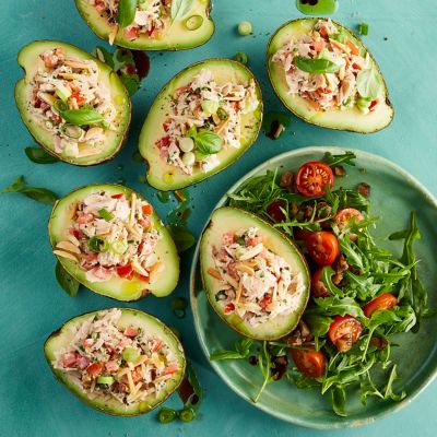 Tuna-filled avocados with tomato salad