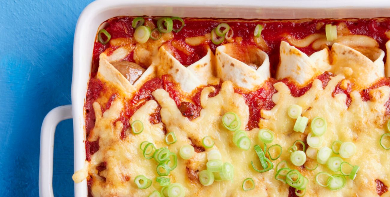 Sausage enchiladas with tomato salad