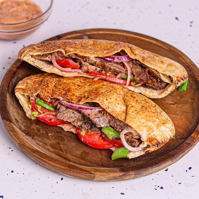 Ribeye Steak Kebab with Iceberg Lettuce, Tomato, Onion & Harissa