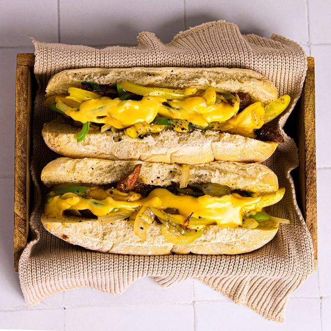 Korean BBQ Philly Cheese Steak with a Cheese Sauce on Floury Bap