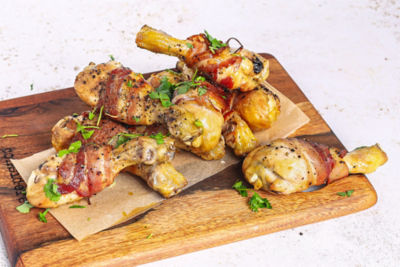 Charruso De Frango Grilled Chicken Drumsticks Wrapped in Bacon.