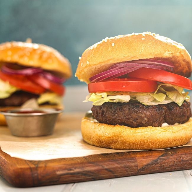 Beef Burger On A Seeded Bun with Lettuce, Tomato & Onion
