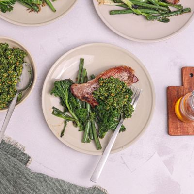 Lamb Leg Steaks with Pistachio Mint Pesto & Greens
