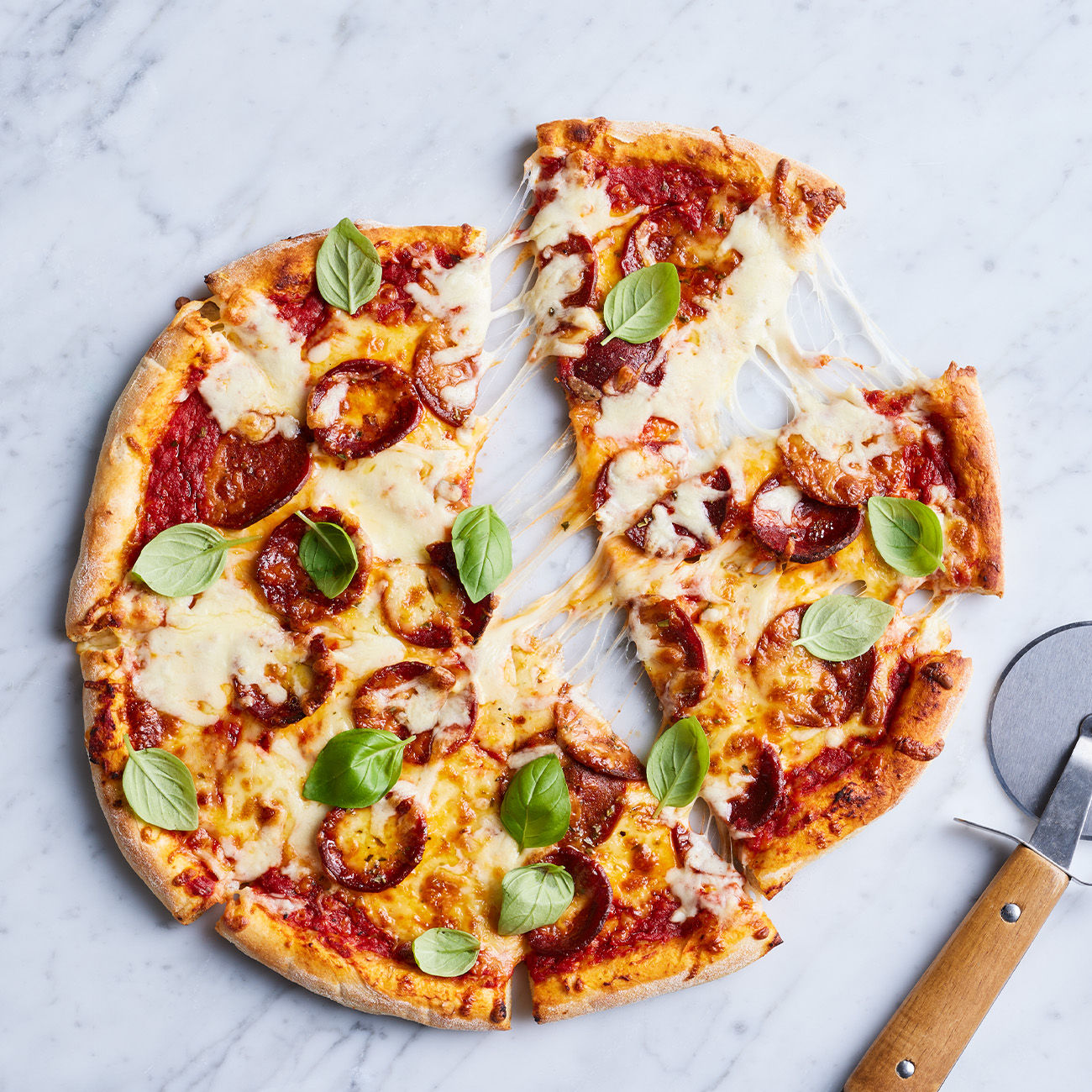 https://foodhub.scene7.com/is/image/woolworthsltdprod/AirFryer-ReheatPizza:Square-1300x1300