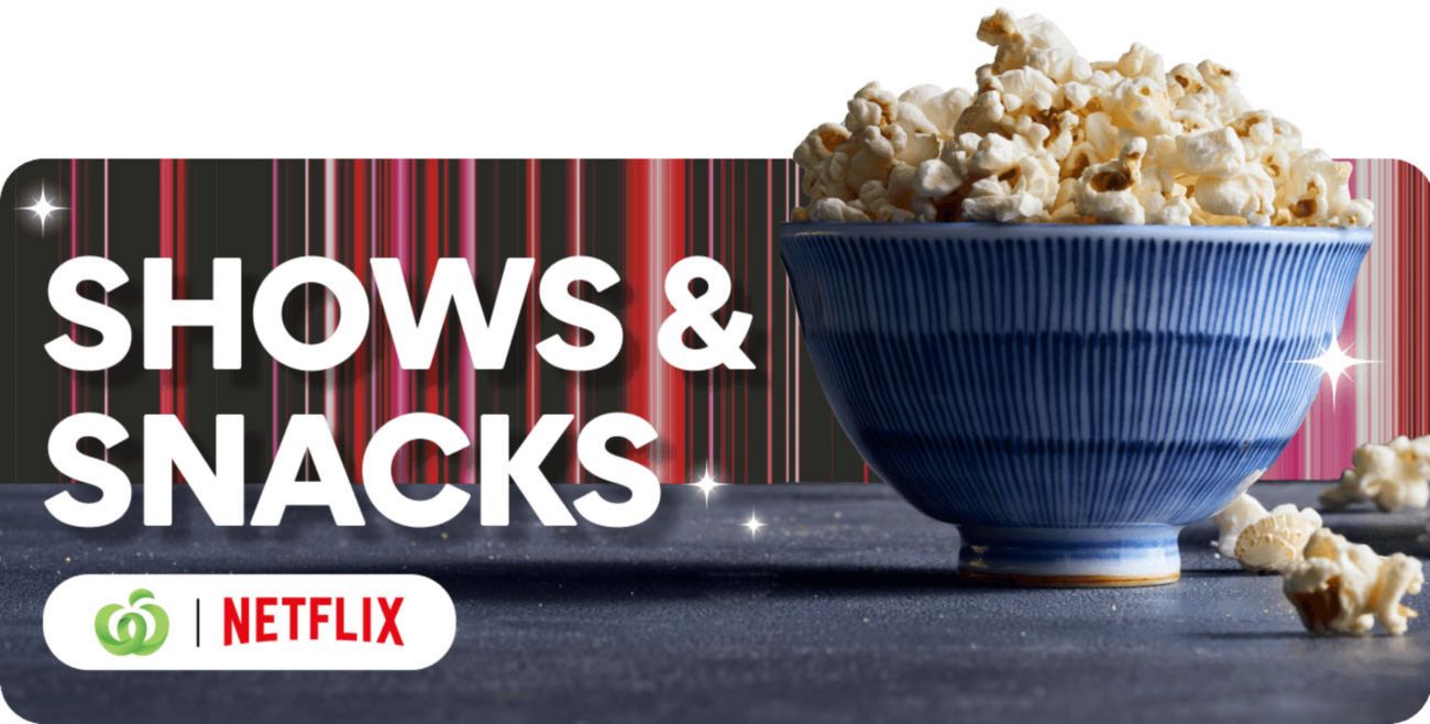 A blue bowl overflowing with popcorn sits on a dark surface. Text reads: SHOWS & SNACKS, with Woolworths and Netflix logos.