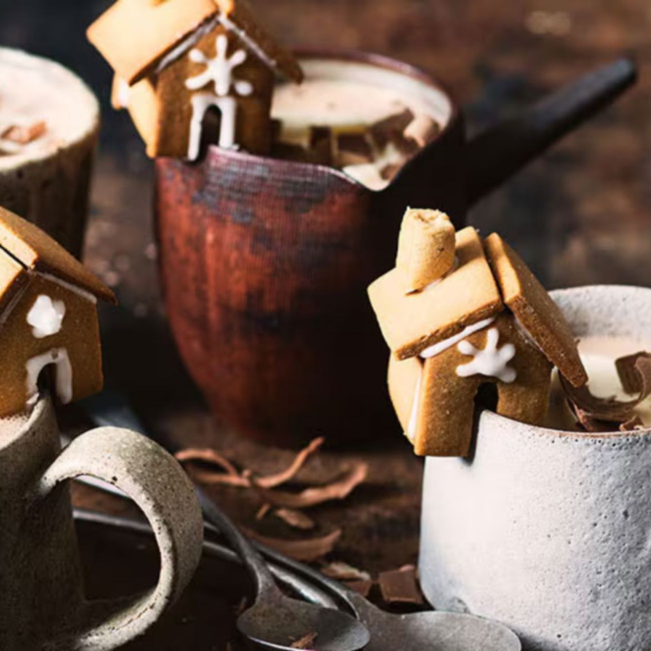 Cups with mini gingerbread houses decoration