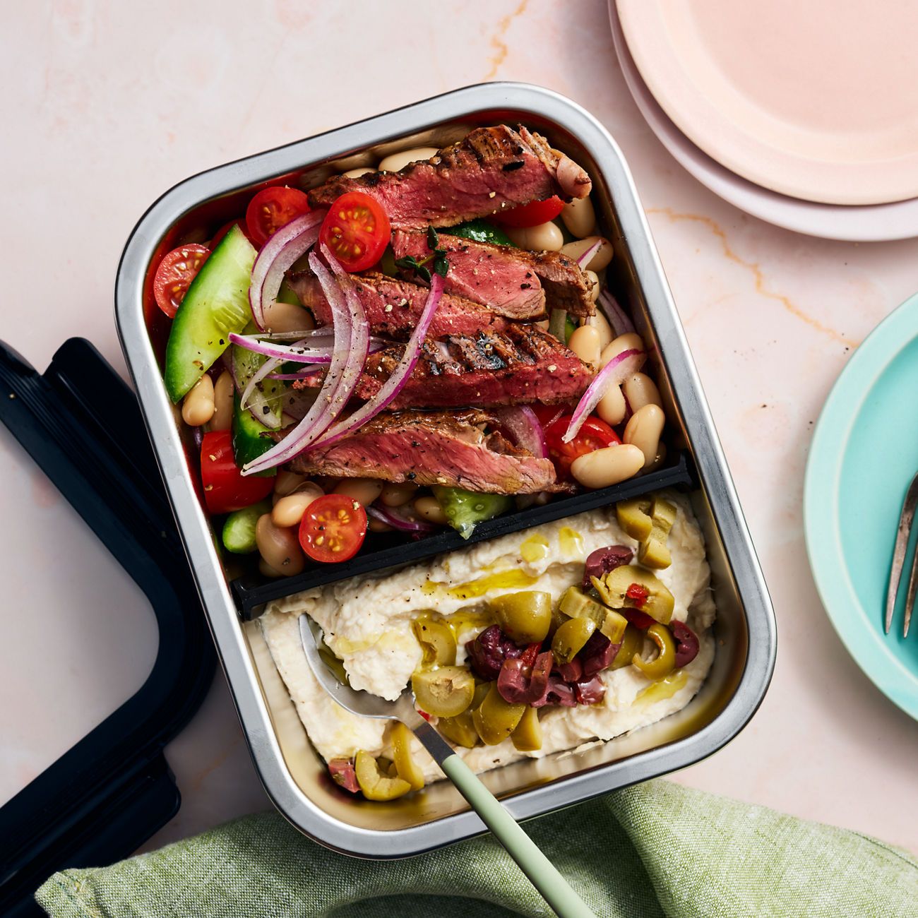 Greek lamb salad with whipped fetta & beans in Fissler stainless steel container