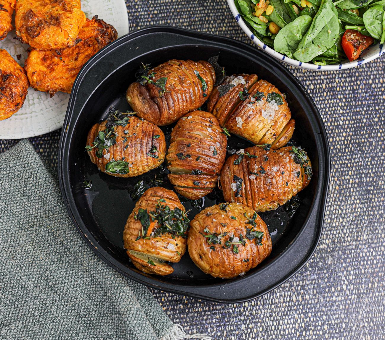 https://foodhub.scene7.com/is/image/woolworthsltdprod/air-fryer-hasselback-potatoes:Mobile-1300x1150