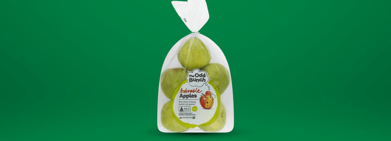 A bag of The Odd Bunch Adorable Apples by Woolworths. Green apples that dream of being tasted, not wasted.