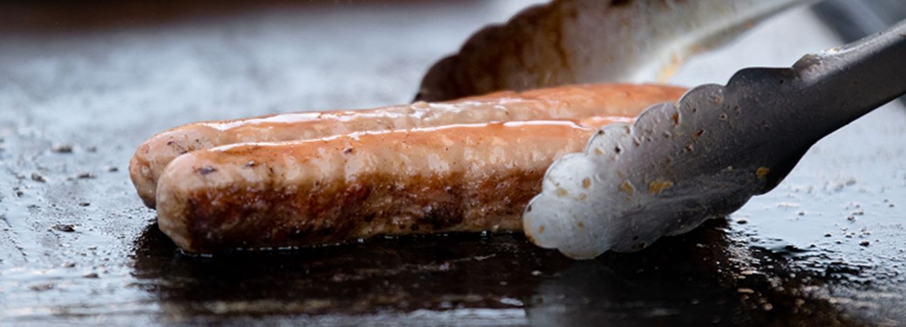 Cooking sausage on BBQ