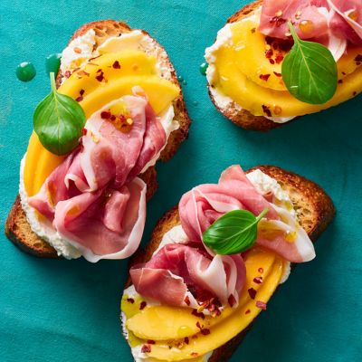 Chilli, Mango, Prosciutto & Feta Crostini