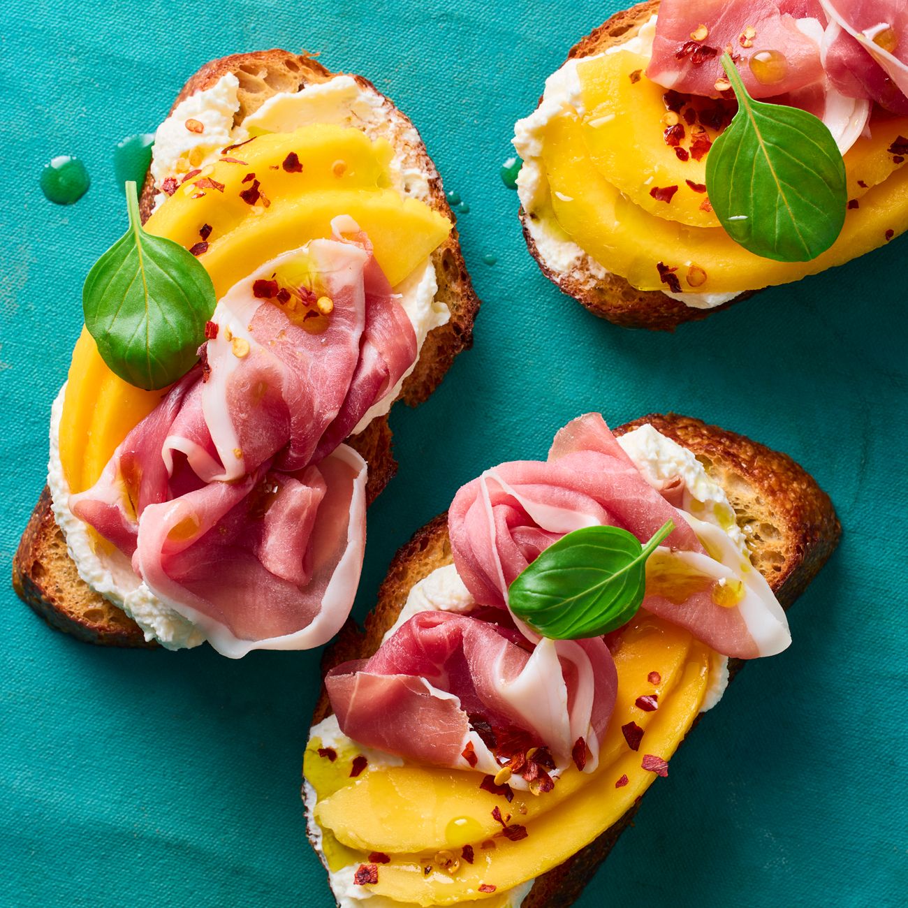 Chilli, Mango, Prosciutto and Feta Crostini