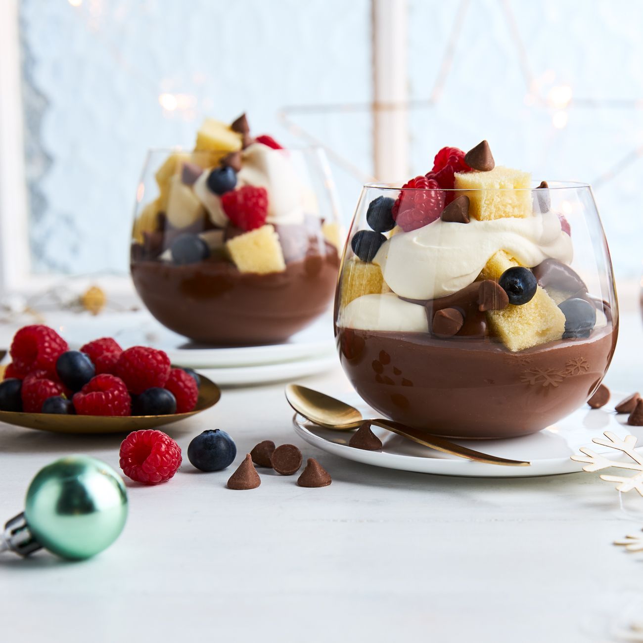 https://foodhub.scene7.com/is/image/woolworthsltdprod/fi-2312-chocolate-custard-and-berry-trifle-cups%3ASquare-1300x1300