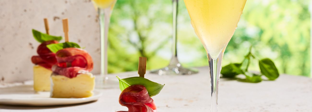 Frozen peach Bellini with charcuterie skewers
