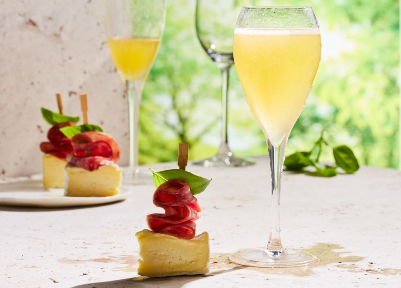 Frozen peach Bellini with charcuterie skewers