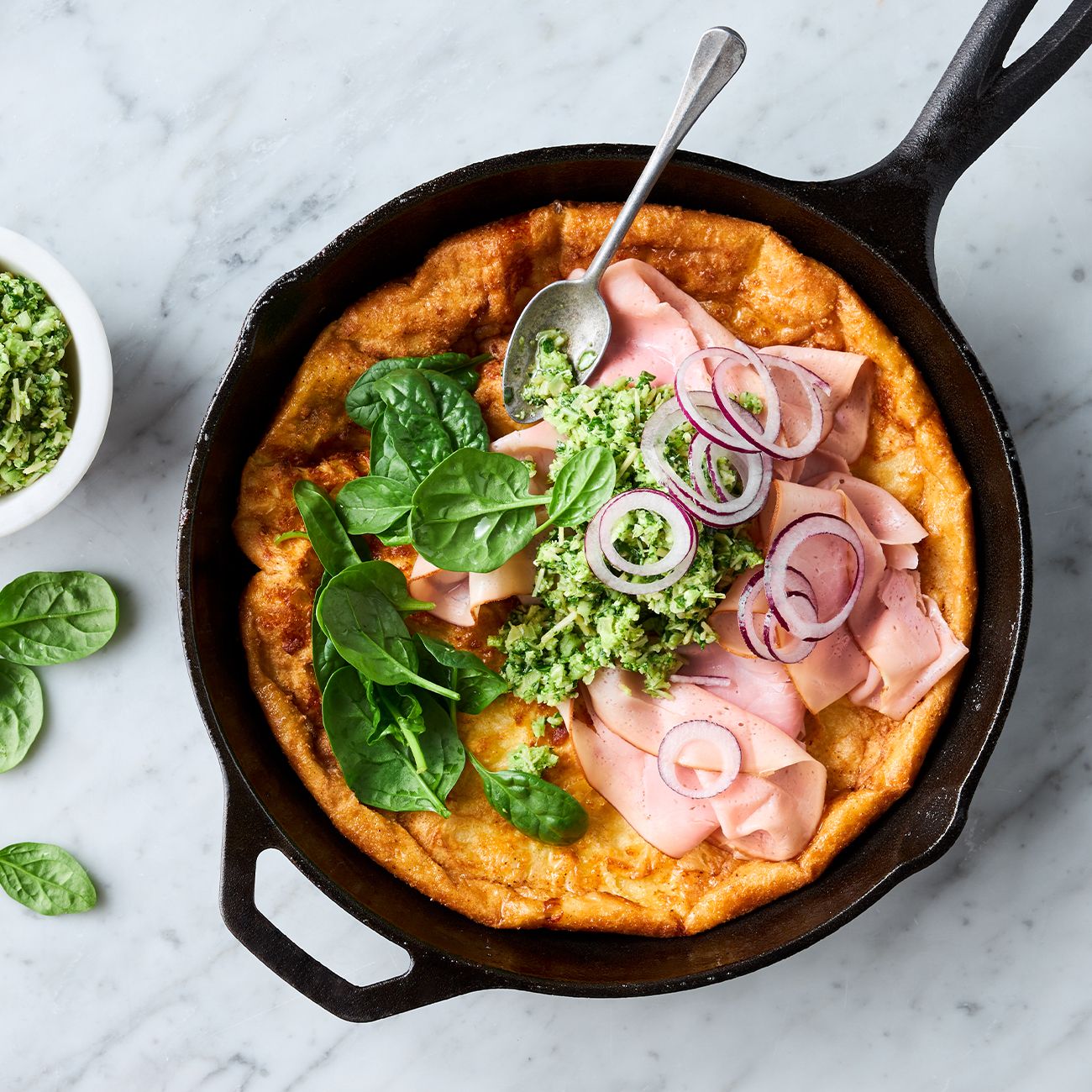 Ham & cheese Dutch baby with broccoli pesto