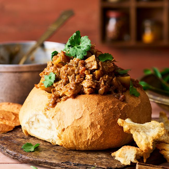 Bunny chow (African-style chicken curry in a loaf)
