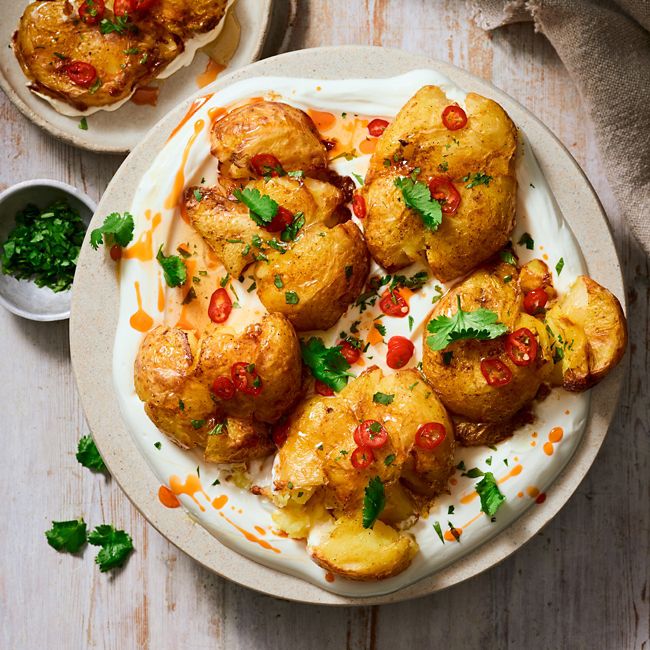 Curry roasted smashed potatoes with chilli labneh