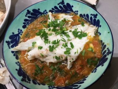 Fish simmered in spicy tomato broth