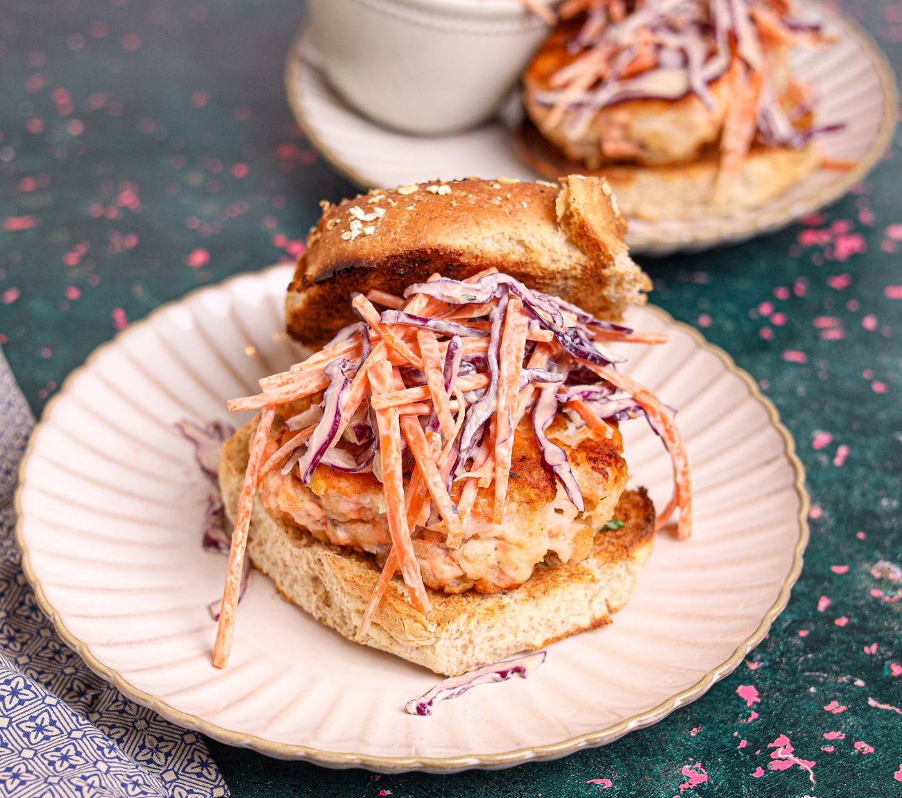 https://foodhub.scene7.com/is/image/woolworthsltdprod/prawn-and-salmon-burgers-with-lime-slaw:Mobile-1300x1150