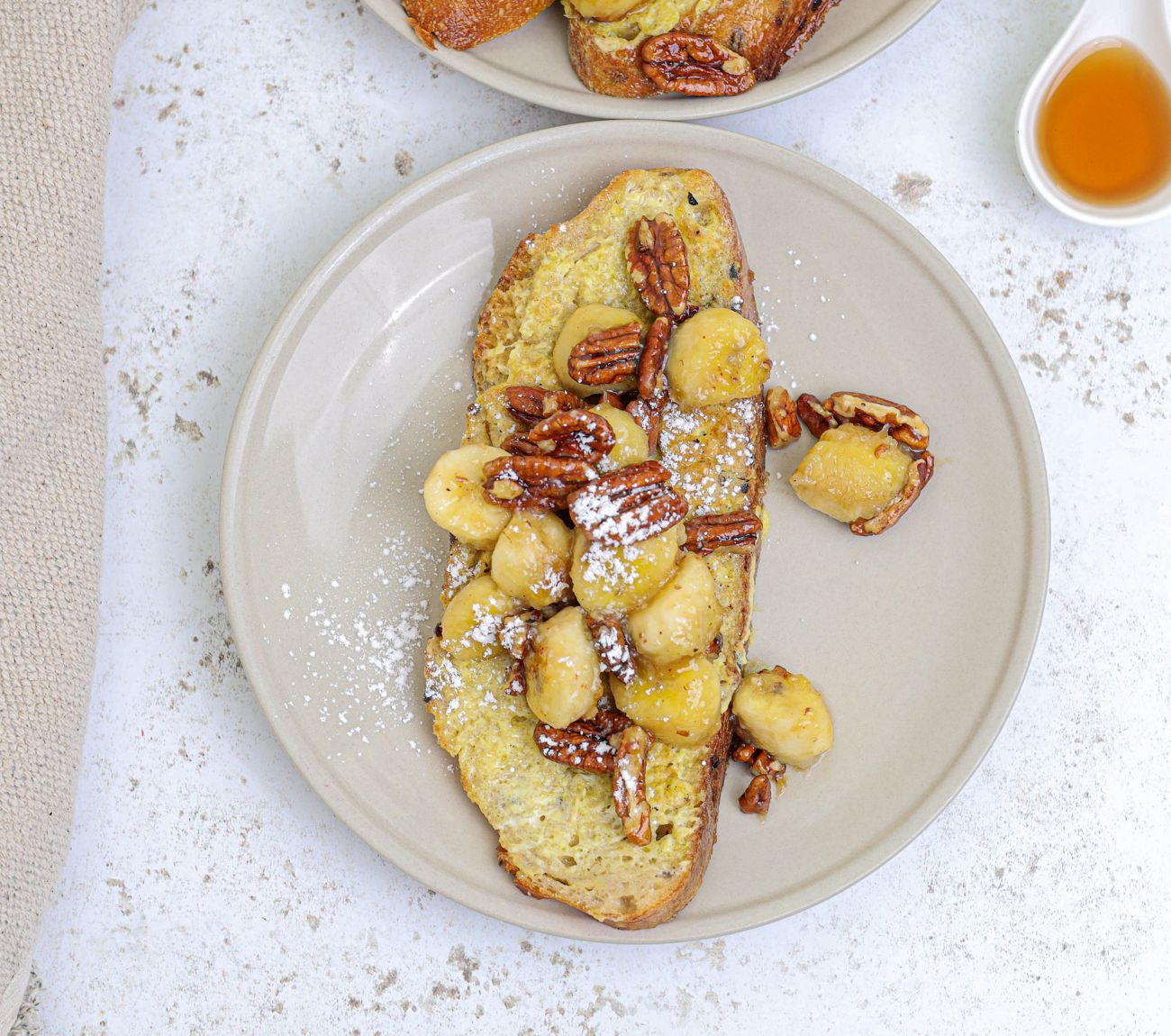 https://foodhub.scene7.com/is/image/woolworthsltdprod/wholemeal-coconut-french-toast-with-bananas-and-pecans:Mobile-1300x1150